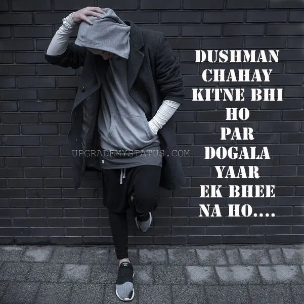 a boy in a grey hoody standing in front of Black wall over it attitude line is written
