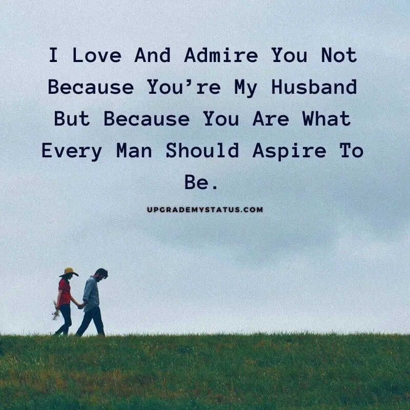 couple is walking on a grass holding hands over it husband wife love message is written
